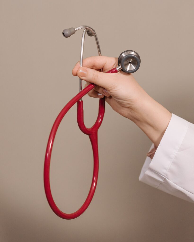 A doctor holding a stethoscope, representing physician care services in Lucknow